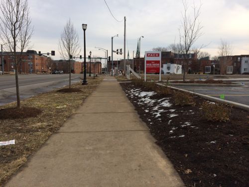 The able-bodied not pushing a stroller or walking  with a small child and approaching from the west will likely but through the parking lot (right) rather than use the walkway where the red sign is located.