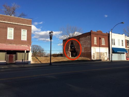 I'm not convinced a park/plaza is the answer when nearby buildings are boarded up -- one has a giant hole in the side.