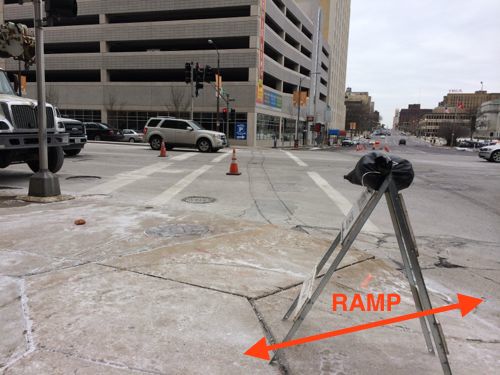 Crossing Tucker requires entering the moving traffic lane on Olive to use the one ramp facing Olive