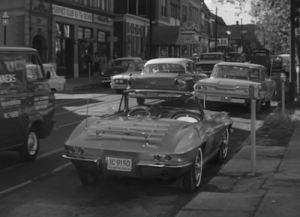 The familiar Corvette from the Route 66 television series parked on Olive in Gaslight Square, from episode that aired November 30, 1962 -- click image for more detail at IMDB.