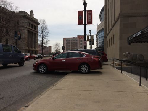 City police had out of town journalists park on the sidewalk during a basketball tournament because...homeland security  