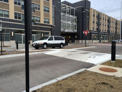 Raised crosswalk on N. 15th  in East St. Louis, the new Jazz at Walter Circle senior housing building in the background 