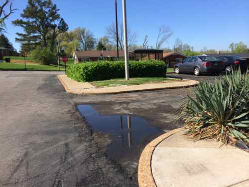 Looking back toward the bus stop we need more ADA issues. Site issues, however, don't require  new building to be addressed. 