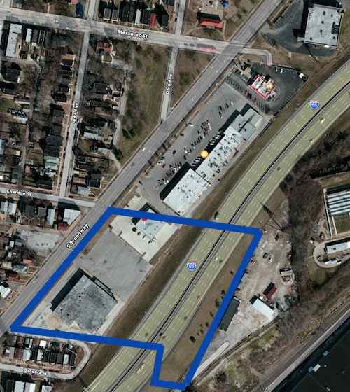 The blue lines mark the approximate outline of the 1964 theater site. 
