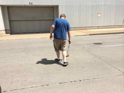 DJF measuring 9th Street at MLK, the convention center in the background