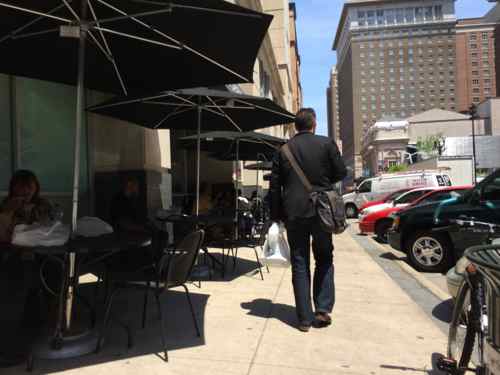 May 6th no improvement in the sidewalk, but the manager says they've received compliments for reducing the number of tables & chairs 