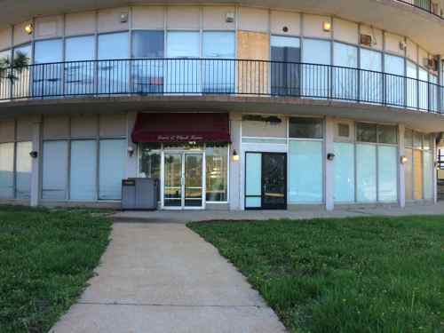 The west entry to the Lewis & Clark Condo tower, one level below the east main entry