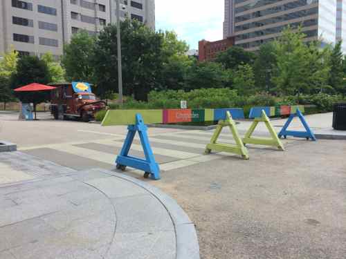 Colorful barricades close off 9th Street to vehicles