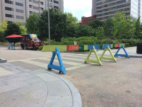 Colorful barricades close off 9th Street to vehicles, the old fire ice cream truck is allowed in to vend 