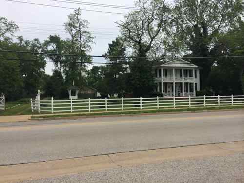 Most of the housing in this area are modest one-story  homes from the 1920s-1960s, this house across the street was built in 1844