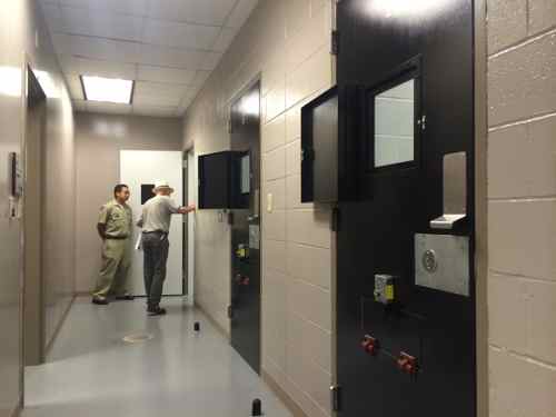 The only clue this isn't most offices is the bank of holding cells and nearby interview rooms.