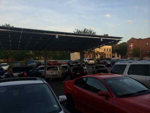 View of the carport in the center of the small parking lot