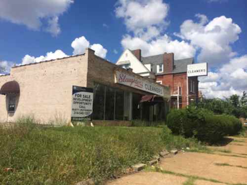 Directly across the street a 1945 commercial building is vacant. With its side parking lot this could be a good market.  