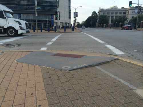 The ramp at 14th & Clark isn't directional for crossing Clark, also too narrow. The paving here creates a serious trip hazard.