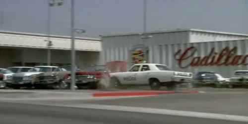 One of the most memorable scenes was a police car s,mashing into a line of new Cadillacs. 
