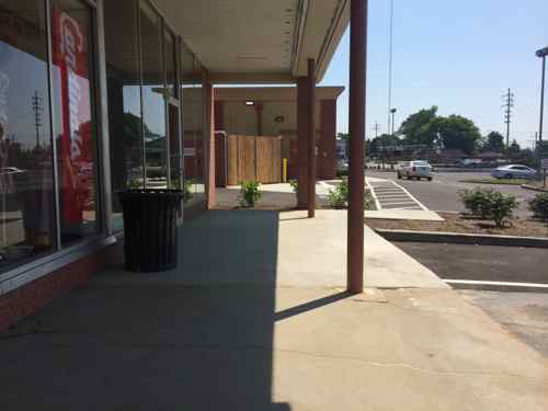 Looking back from in front of the shops you can see the new concrete, this could've easily sloped to provide access.  