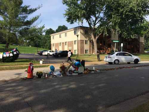 The roses end at the spot where his body was left for four hours the afternoon Saturday August 9th, 2014