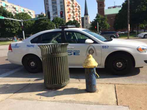 At 12:31pm I posted this image to my blog's Twitter account & Facebook page with the text: "This morning a @SLMPD traffic cop parked in front of a hydrant in a @STLMetro bus stop, forcing me to go 2 blocks east to catch the bus"