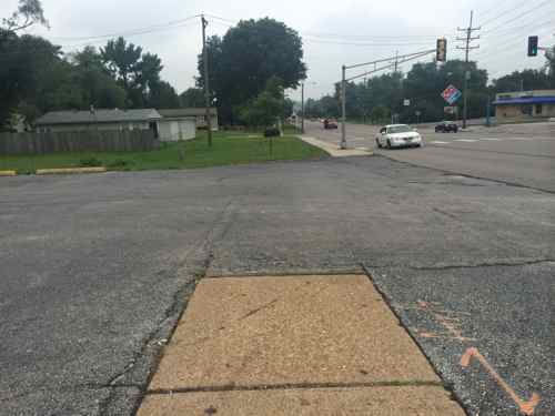 In this area of W. Florissant the pedestrian experience is odd; different surfaces, different distances from the road. Very unplanned!  