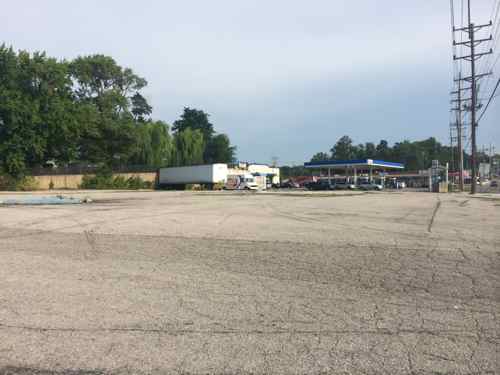 Between the Taco Bell and the corner gas station is a rare vacant parcel of land. 