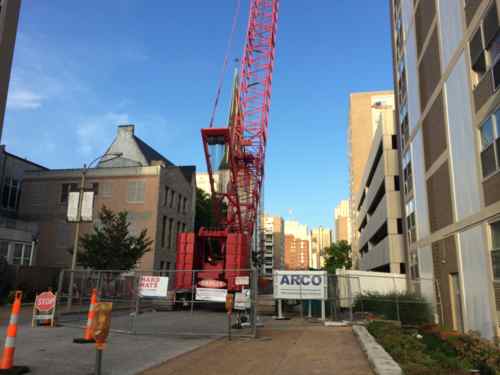 To increase the amount of off-street parking they've built a parking garage between two of their buildings 