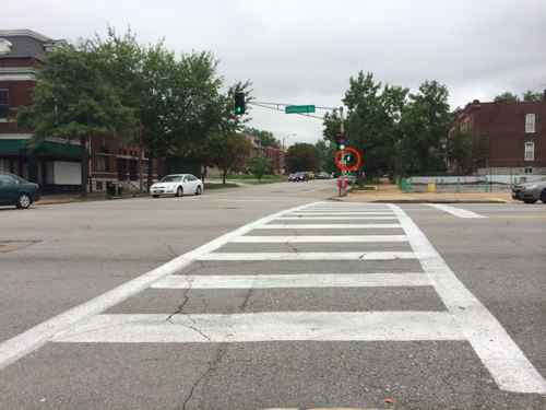 September 2014: Within the last year automatic pedestrian signals have been added (circled in red) and the crosswalks made more visible.