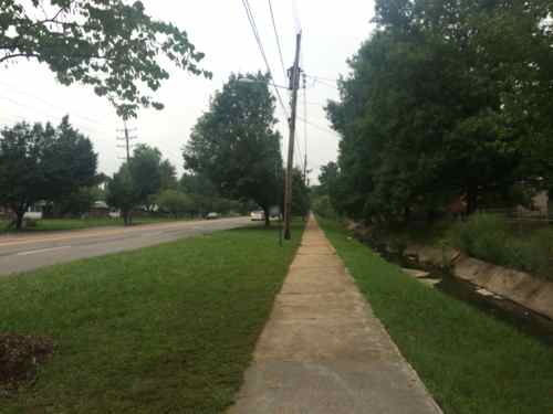 On the east side, after Nesbit Dr, you get a long stretch with no intersecting streets, a concrete creek separates W. Florissant from backyards