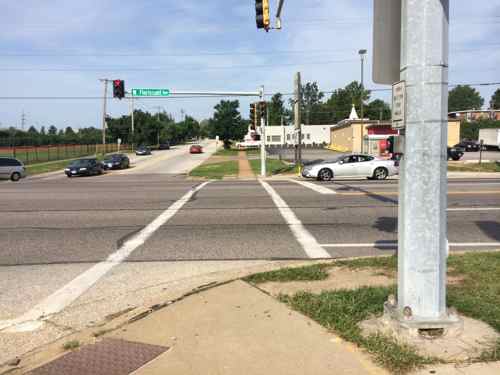 Very few crosswalks exist, the ones that do are poorly designed. Here the crosswalk and ramp have no relationship to each other. One of the rare spots where curbs exist.