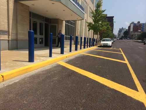 Paint is cheap, by painting the pavement in addition to the curb they've made it clear this isn't for parking. Location: in front of St. Louis Police Headquarters on  Olive. 