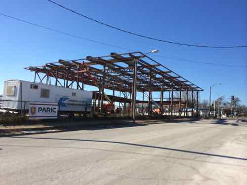 The steel structure for the main showroom going up in February 2014