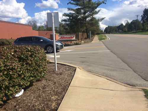 The next entry also lacked a pedestrian route. No other pedestrian route into Woods Mill Plaza was found despite the presence of sidewalks & bus stops. 