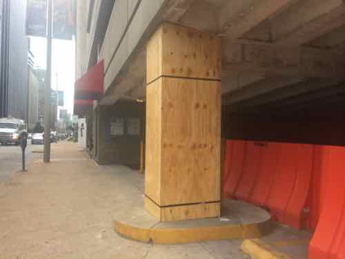 I took this picture of the stone-clad columns getting wrapped in plywood before the previous pic