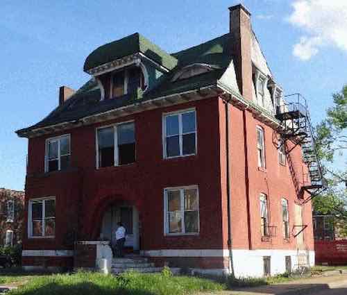 This March 2014 photo from GEO St. Louis shows the old fire escape from when the house was divided into multiple units. 