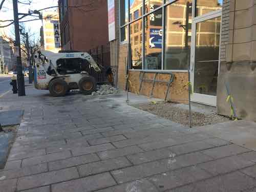 January 21st: sidewalk removed in front of new door is bigger than yesterday, old ramp being busted out