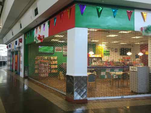 One of several restaurants in the mall, this one was just about to open. Soccer was playing on the TV.  