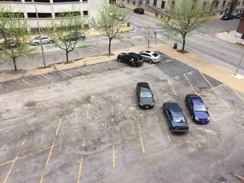 Overview from April 2015, the center pavement was in poor condition. The disabled spaces were no longer marked. 