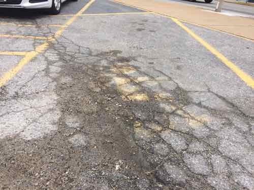 Not really the fault of those drivers, the pavement marking is almost gone and the space lacks the required vertically-mounted sigh