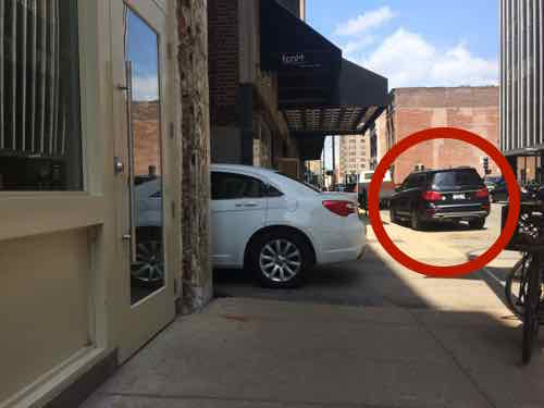May 29, 2015 at 10:58am: An hour later the SUV had moved to a metered parking space (circled in red), but a white sedan took its place