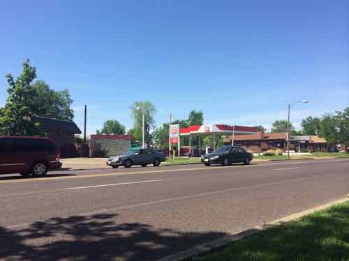 Two gas stations where Broadway & Osceola meet might become one urban station with building in front, pumps behind.  