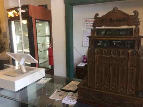 This symbolizes what they've done: the new iPad-based register sits next to a vintage register.