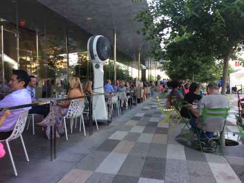 Here you see people at the upscale restaurant (left) and regular park patrons sitting at movable tables &amp; chairs located throughout the park (right).