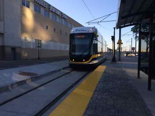 The modern streetcar approaching the end near Dallas Union Station.