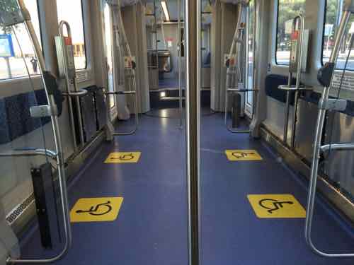 The interior is very similar to their light rail vehicles -- the center is open for standing passengers,  wheelchairs , bikes, strollers, etc  