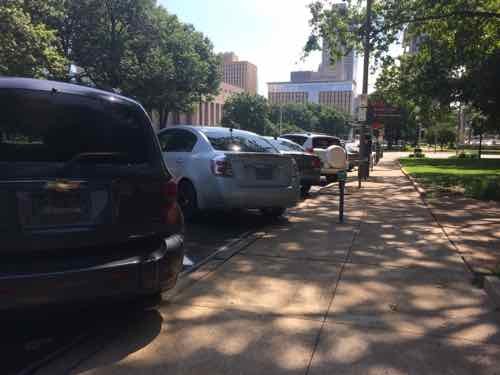 View from the sidewalk, also from Thursday, Back-in parking is safer for cyclists  than front-in 