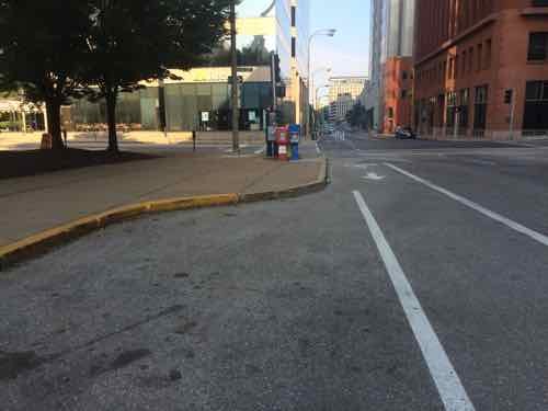 Curb bulbs are great for pedestrians, bad for protected bike lanes.  