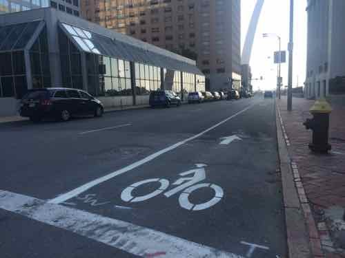 Looking East from Broadway. Why wasn't the single row of parking placed to protect the bike lane? 