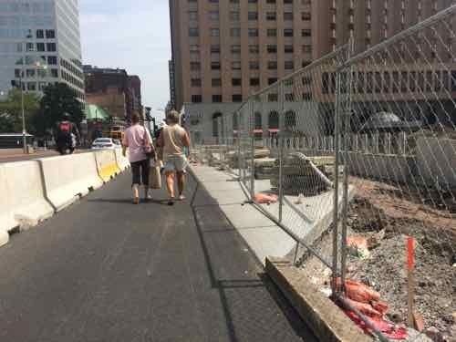 Looking North along 4th, with Luther Ely Square on the right, temporary  Jersey Barrier wall on left.