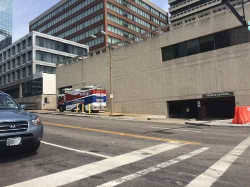 The South side of Gateway Tower, KMOV's truck parks where the public sidewalk should be