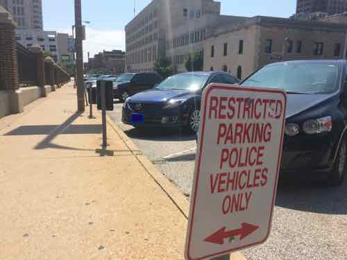 Privately-owned vehicles now park where police vehicles used to park. July 23, 2015