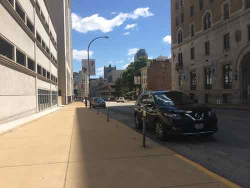 Wednesday August 26th at 12:51pm, the vehicle and guy who threatened me in the distance -- he's wearing a red shirt with white shorts & cap. . 